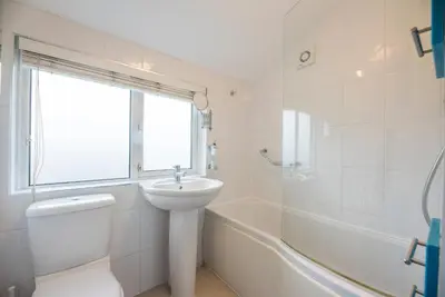 a bathroom with a sink and a toilet and a tub at Telford, Aldeburgh in Aldeburgh