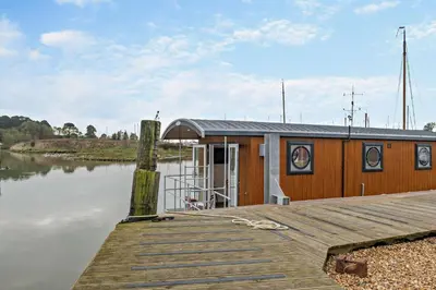 a house on a dock on a body of water at 1 Bed in Woodbridge oc-s30322 in Woodbridge