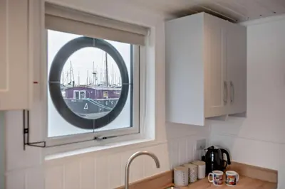 a kitchen with a window over a sink and a kitchen counter at 1 Bed in Woodbridge oc-s30322 in Woodbridge