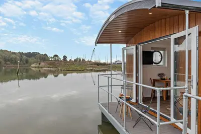 a small boat on a body of water at 1 Bed in Woodbridge oc-s30322 in Woodbridge
