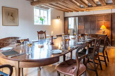 a large dining room with a large wooden table at River House in Kersey