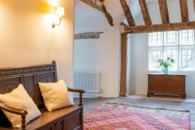 a bedroom with a bed and a window at River House in Kersey