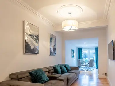a living room with a couch and a table at Cosy flat in Leigh - Pass the Keys in Southend-on-Sea