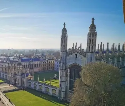 a large building with two towers on top of it at Modern 1Bed Apartment supercentral in Cambridge