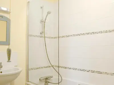 a bathroom with a shower and a sink at The Wood Shed - E1919 in Westleton
