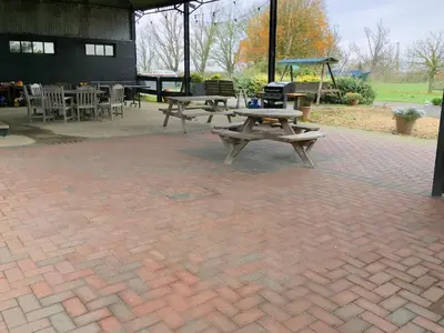 a picnic table and a playground with tables and chairs at Pheasant in Welney