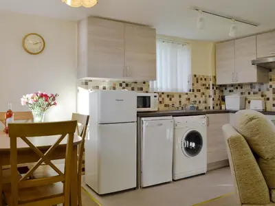 a kitchen with a white refrigerator and a dishwasher at Sally's Nest - E3042 in Blyford