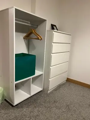 a white closet with a green box in it at Serenity-ESE Entire Home in Basildon
