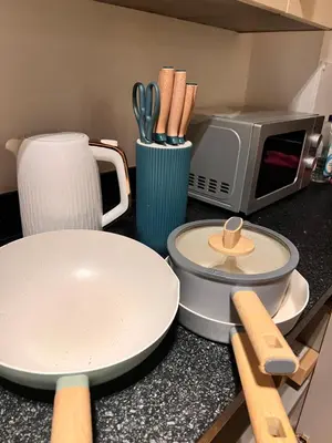 a kitchen counter with a plate and a microwave at Serenity-ESE Entire Home in Basildon