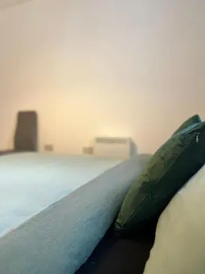 a pillow sitting on a bed in a room at Serenity-ESE Entire Home in Basildon