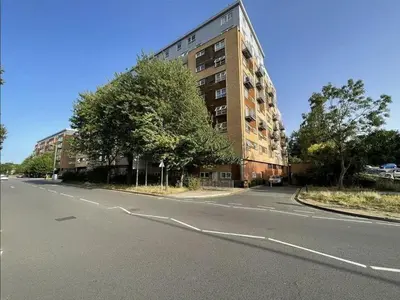 an empty street in front of a tall building at Serenity-ESE Entire Home in Basildon