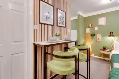 a room with a table and two chairs at Stylish and modern studio flat Free parking - Pass the Keys in Cambridge