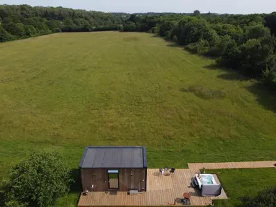 an aerial view of a house in a large field at Mirror Houses Pound Farm - Meadow OOD in Saxmundham