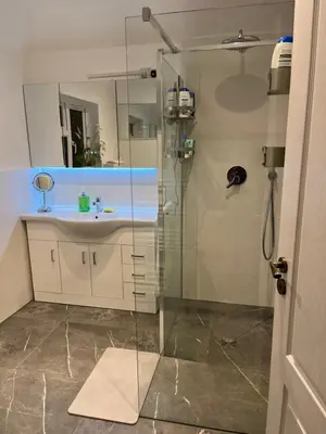 a bathroom with a sink and a shower at House in city centre with free parking in Cambridge