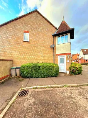 a brick house with a white door on a street at 2 Bedroom House off A12 Colchester in Lexden