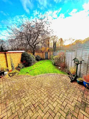 a backyard with a brick yard with a fence at 2 Bedroom House off A12 Colchester in Lexden