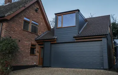 a black garage door with a window on top of a house at Oak View Lodge Luxury Master Studio near Ipswich & Woodbridge in Playford
