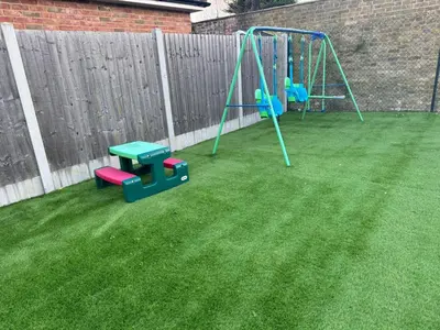 a yard with a playground with a swing at Double bedrooms In Spacious Home in Harold Wood