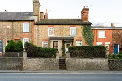 a brick house on the side of a street at Cosy House - Stanstead Airport in Bishops Stortford