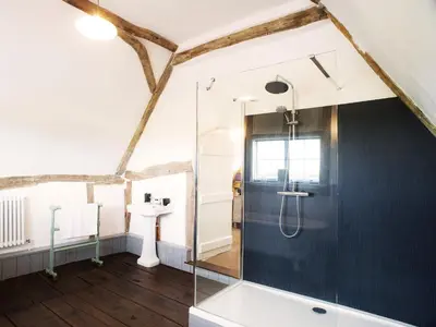 a bathroom with a shower and a sink at The Cross Wing by The Suffolk Cottage Collection in Peasenhall