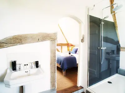 a bathroom with a sink and a shower at The Cross Wing by The Suffolk Cottage Collection in Peasenhall