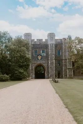 a large castle with a gate and a grass field at Gatehouse East in Saint Osyth