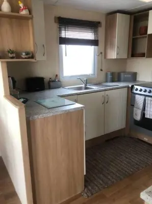 a kitchen with a sink and a counter top at The Duckhouse in Great Horkesley