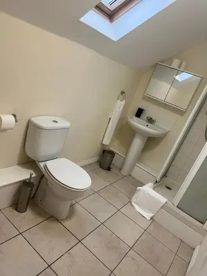 a bathroom with a toilet and a sink at Grange Luxe 4 in Martlesham Heath