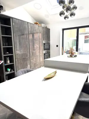a kitchen with a white counter top in a room at Rose home in Haverhill