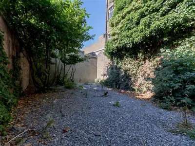 an alley between two bushes and a building at Studio flat in Heart of Southend - Pass the Keys in Southend-on-Sea