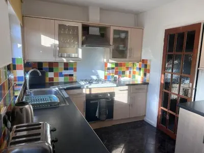 a kitchen with a sink and a stove top oven at Delightful-Ipswich Suffolk-4 Bed-SelfCatering-Contractor-Parking-Wifi in Copdock