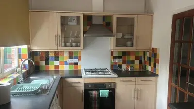 a kitchen with a sink and a stove top oven at Delightful-Ipswich Suffolk-4 Bed-SelfCatering-Contractor-Parking-Wifi in Copdock