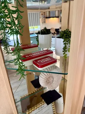 a glass table with some plants on top of it at Stylish Inviting 2 Bedroom Caravan with Sea View in East Mersea