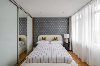 a bedroom with a large white bed and a window at Luxurious City Centre Apartment in Chelmsford with Sky TV, Sports, Movies & Netflix in Chelmsford