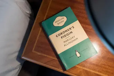 a book sitting on top of a wooden table at The Book Nook, Woodbridge in Woodbridge
