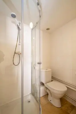 a bathroom with a toilet and a shower at Barleys Cottage - Aldeburgh Coastal Cottages in Aldeburgh