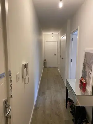 a hallway of an office with a desk and a door at Prestige 1 bed apartment in Shenfield