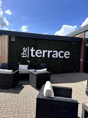 an entrance to an office building with couches and chairs at Harwich - Caravan - Sleeps 10 - Garden - Pool in Harwich