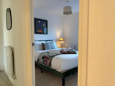 a bedroom with a bed in a room at Modern & Elegant with Free Parking & Balcony in Cambourne