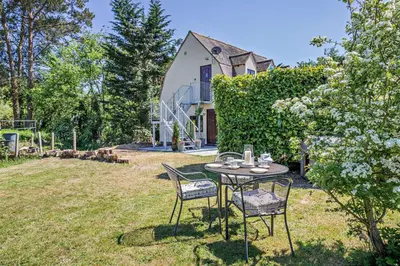a table and chairs in the yard of a house at 1 Bed in Hundon oc-t30616 in Hundon