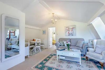 a living room with a couch and a table at 1 Bed in Hundon oc-t30616 in Hundon