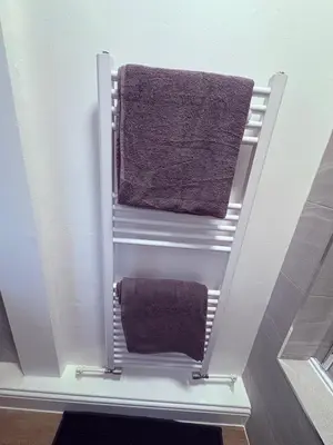 a towel rack with two towels in a bathroom at Central Chelmsford 2-Bed Apt 5 mins to Station in Chelmsford