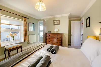 a bedroom with a large white bed and a window at 3 Bed in Hingham oc-m29945 in Hingham