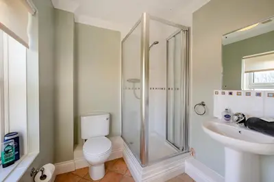 a bathroom with a shower and a toilet and a sink at 3 Bed in Hingham oc-m29945 in Hingham