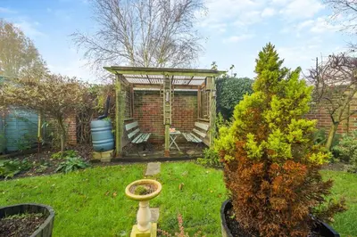a garden with a gazebo and a tree at 3 Bed in Hingham oc-m29945 in Hingham