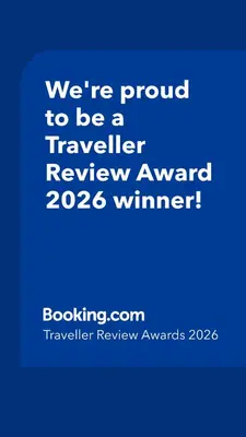 a blue sign that says were proud to be a traveller reviewagency winner at The Cartlodge - Studio Loft Apartment in Horringer, Bury St Edmunds in Westley
