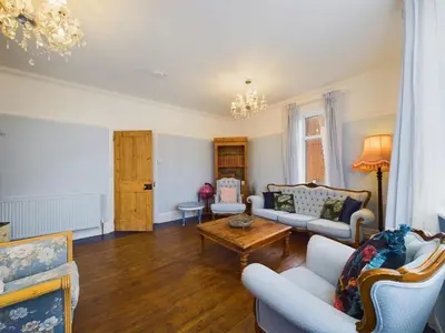a living room with a couch and a table at 2 Bed Apartment- Leigh Broadway in Southend-on-Sea