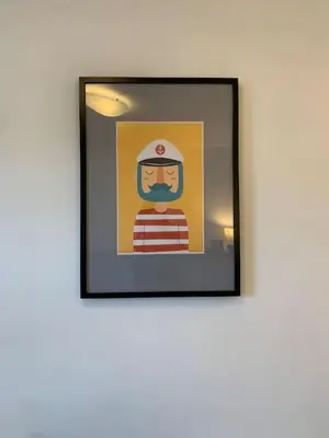 a framed picture of a firefighter on a wall at 3 Bed Family House Free Parking in Southend-on-Sea