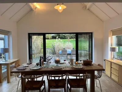 a large dining room with a table and chairs at Charming Cottage nestled in the heart of a picturesque village in Westleton