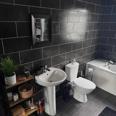 a bathroom with a toilet and a sink at Cosy Home in Chelmsford City, Free WiFi & Free Parking - Mildmay House by Stays Accommodation - Long Stays Welcome in Chelmsford